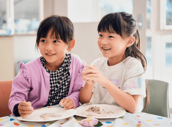 two kids are having polymer clay class