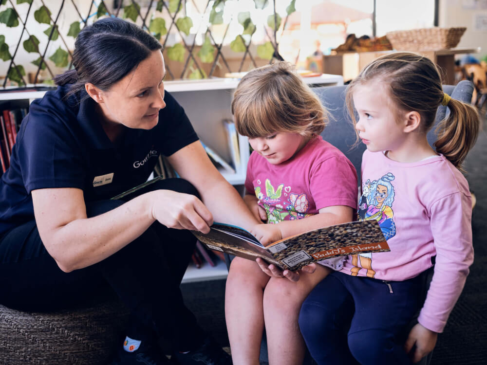 children are listening a story from teacher